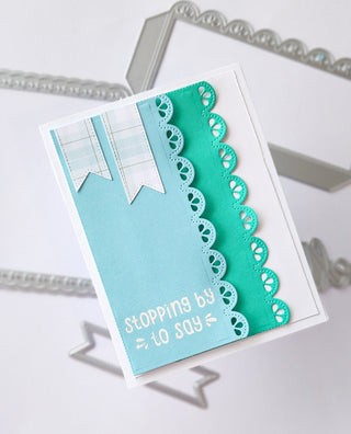 A2 card in blue tones with scalloped decorative elements and banners and sentiment Stopping by to say