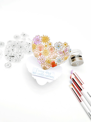 Watch how Emily turns this Hearts Aflutter die into a gorgeous easel card, filled with beautiful colors and lots of shine!